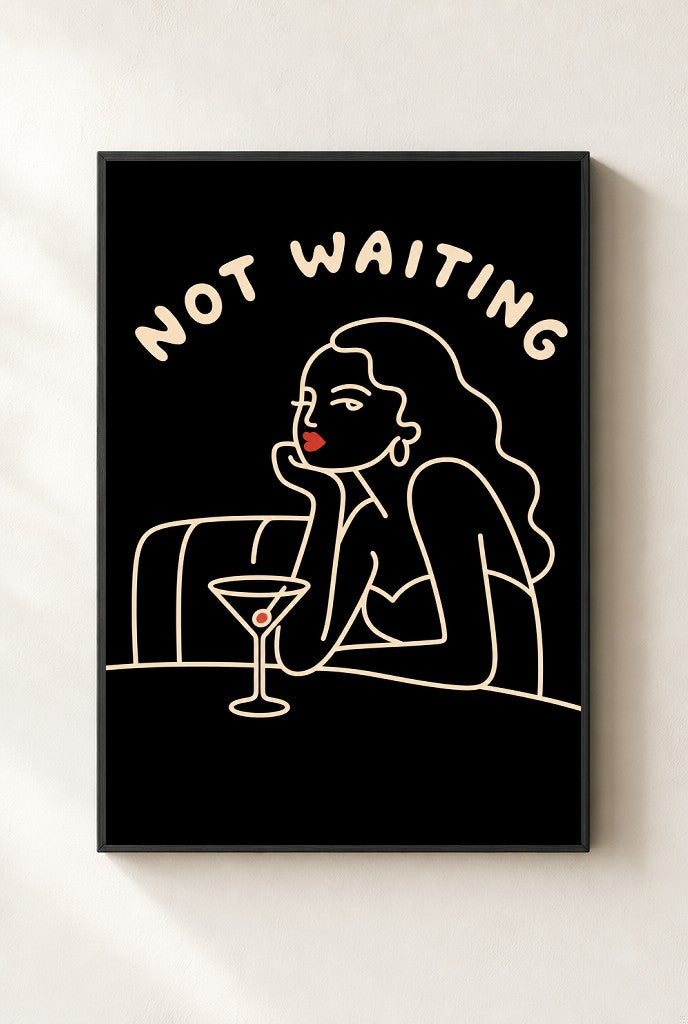 Not Waiting print, mounted in a black wood frame on a cream wall.