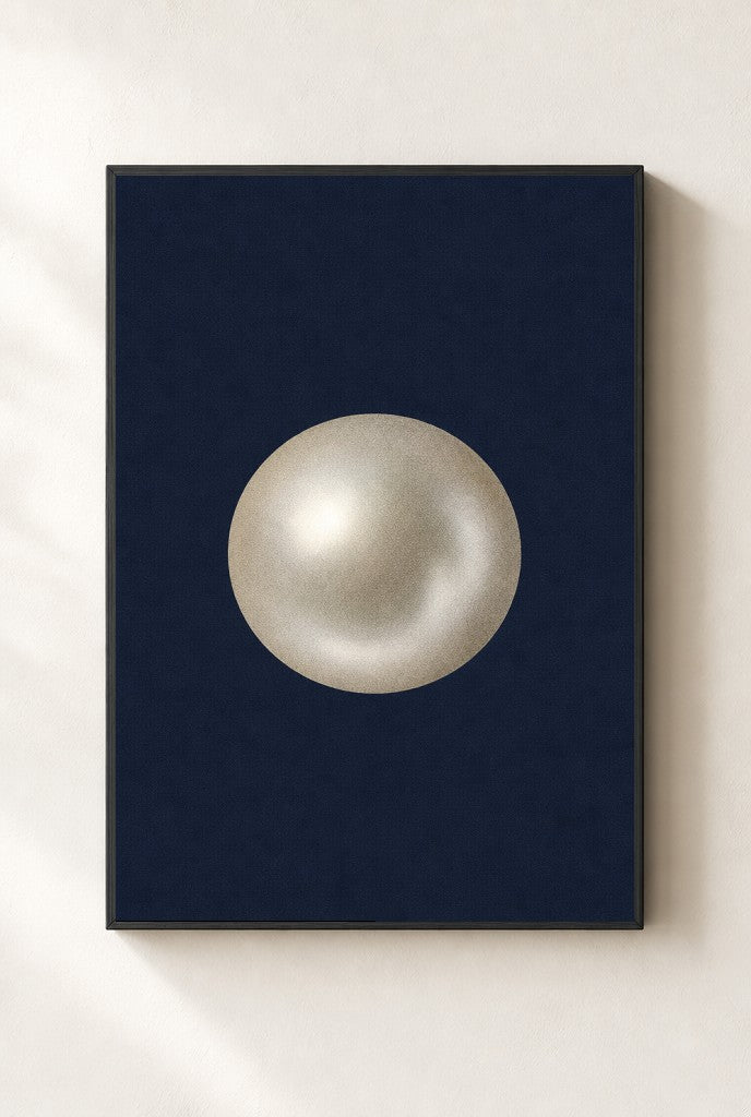 One Pearl, Navy print, mounted in a black wood frame on a cream wall.