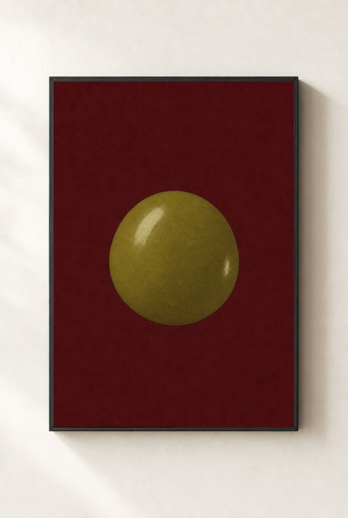 One Olive, Oxblood print, mounted in a black wood frame on a cream wall.
