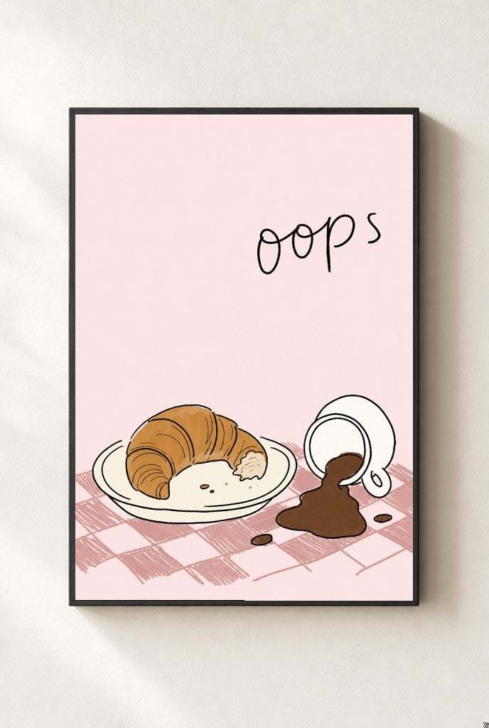 Oops, Croissant print, mounted in a black wood frame on a cream wall.
