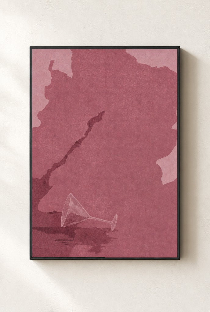 Spilled Martini, Oxblood print, mounted in a black wood frame on a cream wall.