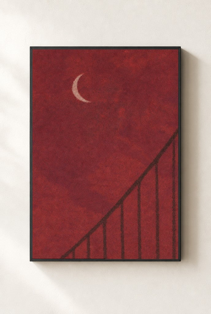 Oxblood Sky, Crescent print, mounted in a black wood frame on a cream wall.