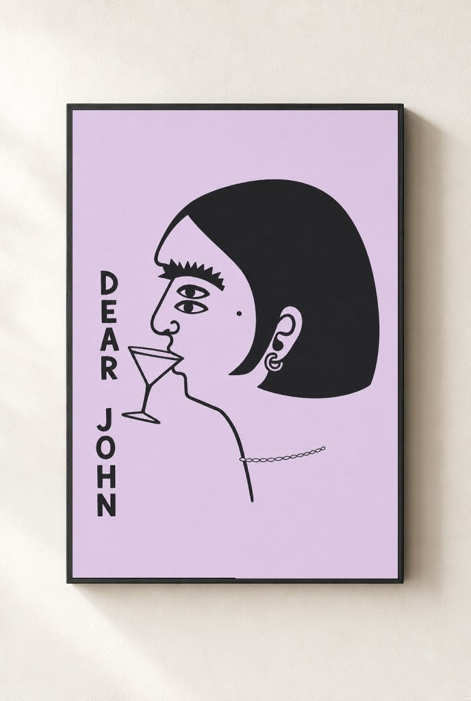 Dear John print, mounted in a black wood frame on a cream wall.