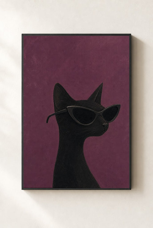 Black Cat, Cat-Eye print, mounted in a black wood frame on a cream wall.