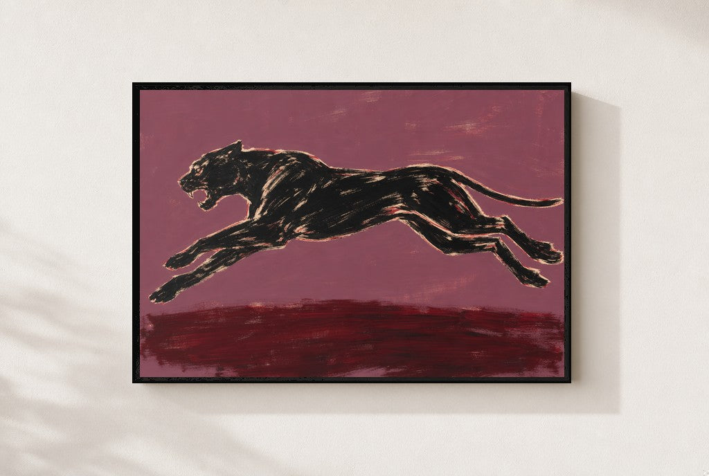 Black Panther, Plum print, mounted in a black wood frame on a cream wall.