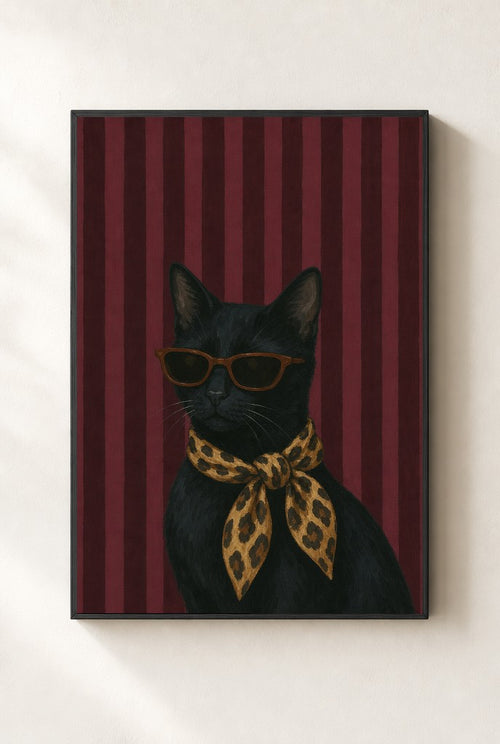 Cat, Leopard Scarf print, mounted in a black wood frame on a cream wall.