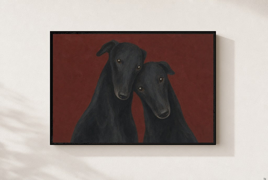 Two Greyhounds, Oxblood print, mounted in a black wood frame on a cream wall.