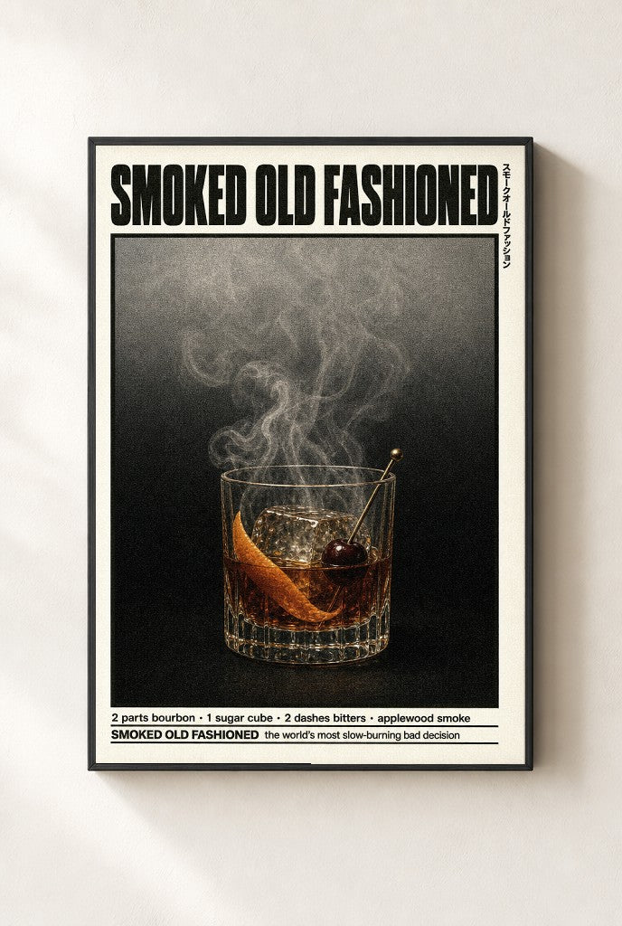 Smoked Old Fashioned print, mounted in a black wood frame on a cream wall.