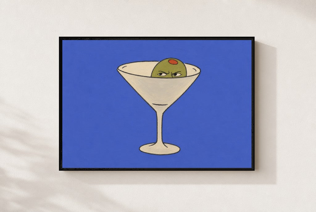 Angry Olive, Martini print, mounted in a black wood frame on a cream wall.