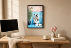 Framed Reading the News hung above a mid-century walnut console with ceramics.