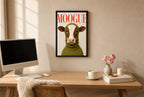 Framed MOOGUE hung above a mid-century walnut console with ceramics.