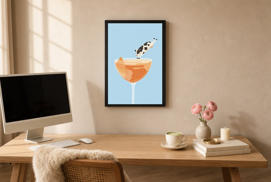 Framed Last Call Belly Flop hung above a mid-century walnut console with ceramics.
