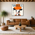 Framed MOOGUE Paris hung above a mid-century walnut console with ceramics.
