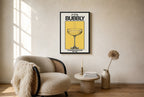 Oversized Champagne Problems leaning at the baseboard of a sunlit living room.