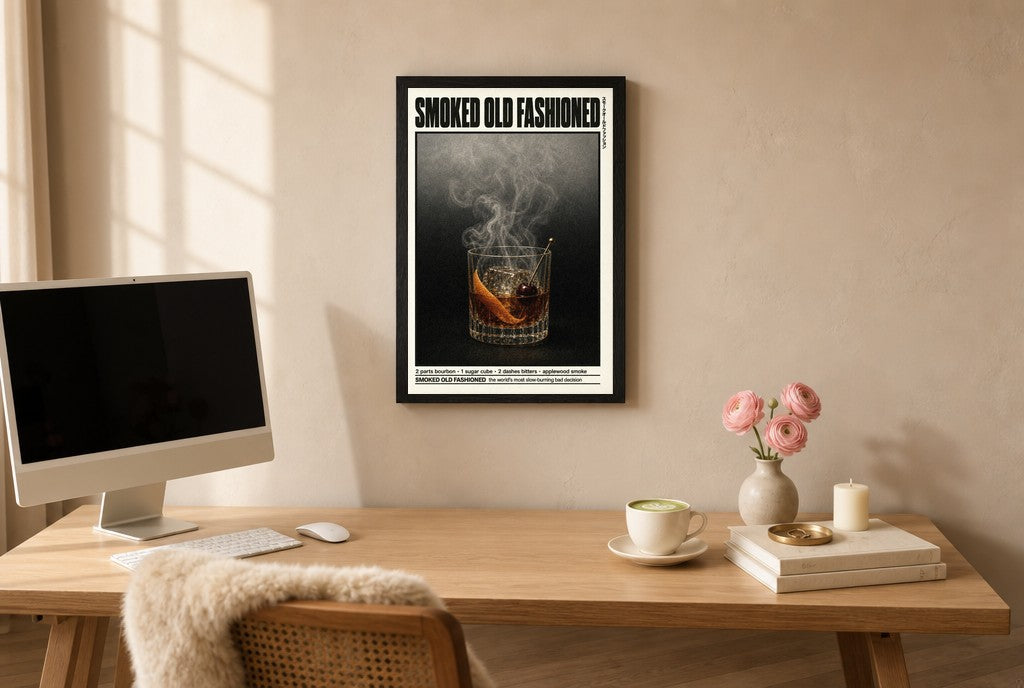Framed Smoked Old Fashioned hung above a mid-century walnut console with ceramics.
