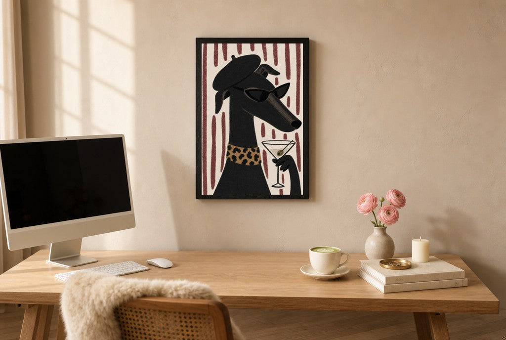 Framed Greyhound, Beret, Martini hung above a mid-century walnut console with ceramics.