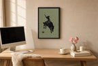 Framed Bronc Rider, Sage hung above a mid-century walnut console with ceramics.