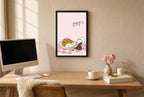 Framed Oops, Croissant hung above a mid-century walnut console with ceramics.