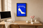Framed Stiletto hung above a mid-century walnut console with ceramics.