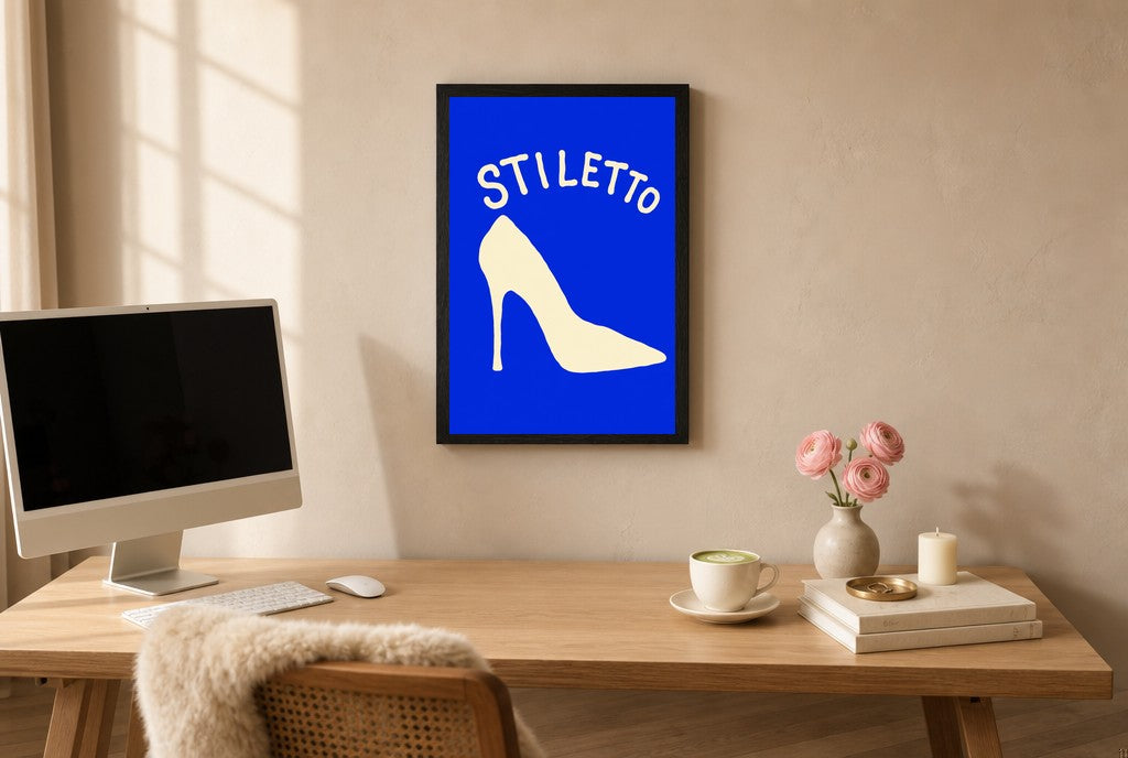 Framed Stiletto hung above a mid-century walnut console with ceramics.
