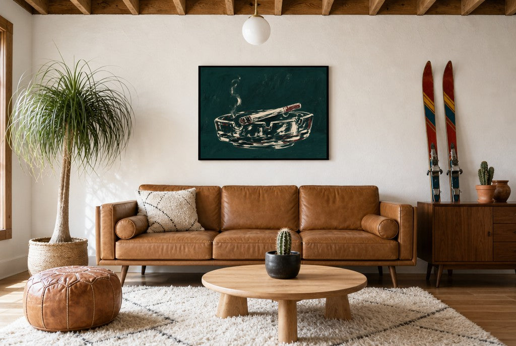 Framed Ashtray, Teal hung above a mid-century walnut console with ceramics.
