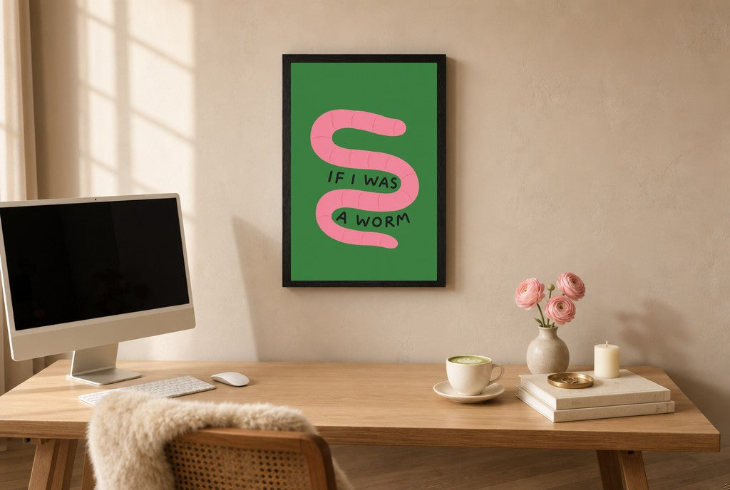 Framed If I Was a Worm hung above a mid-century walnut console with ceramics.