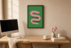 Framed If I Was a Worm hung above a mid-century walnut console with ceramics.