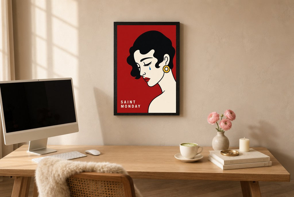 Framed Saint Monday hung above a mid-century walnut console with ceramics.
