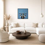 Oversized Showing Off leaning at the baseboard of a sunlit living room.