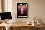 Framed Paloma hung above a mid-century walnut console with ceramics.