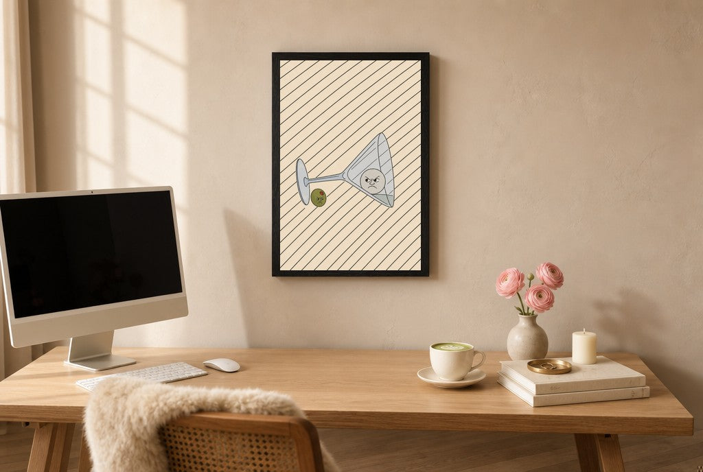 Framed Tipped Martini, Olive hung above a mid-century walnut console with ceramics.
