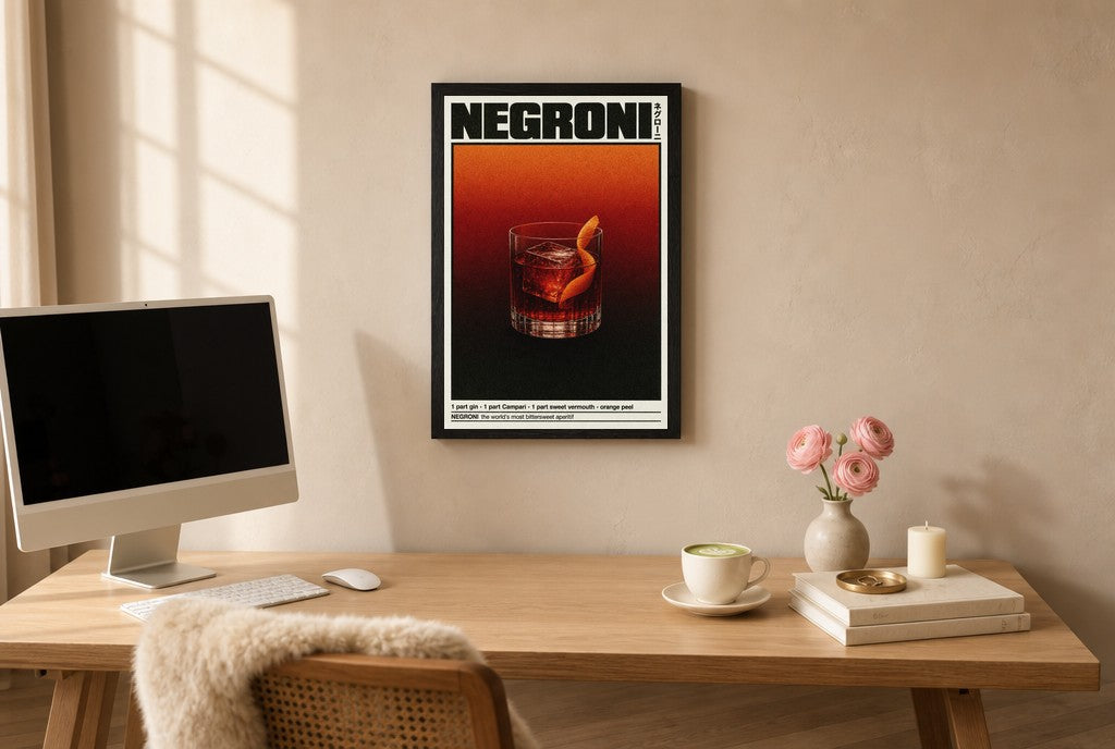 Framed Negroni hung above a mid-century walnut console with ceramics.