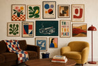 Ashtray, Teal mixed into a layered gallery wall of varied frame sizes.