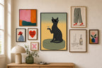 Cat, Martini, Sunglasses mixed into a layered gallery wall of varied frame sizes.