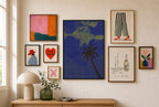 Lone Palm, Midnight mixed into a layered gallery wall of varied frame sizes.