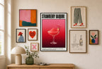 Strawberry Daiquiri mixed into a layered gallery wall of varied frame sizes.