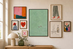 Calm Sea, Two of Us mixed into a layered gallery wall of varied frame sizes.