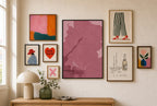 Spilled Martini, Oxblood mixed into a layered gallery wall of varied frame sizes.