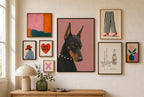 Doberman, Pearls mixed into a layered gallery wall of varied frame sizes.