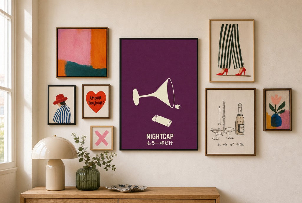 Nightcap mixed into a layered gallery wall of varied frame sizes.