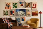 Sheets, Ashtray mixed into a layered gallery wall of varied frame sizes.
