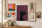 Black Cat, Cat-Eye mixed into a layered gallery wall of varied frame sizes.