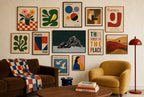 Black Heel, Teal mixed into a layered gallery wall of varied frame sizes.