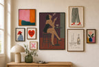 Bar Stool, Smoke mixed into a layered gallery wall of varied frame sizes.