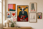 All In mixed into a layered gallery wall of varied frame sizes.