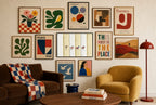 Sand Pilgrimage mixed into a layered gallery wall of varied frame sizes.