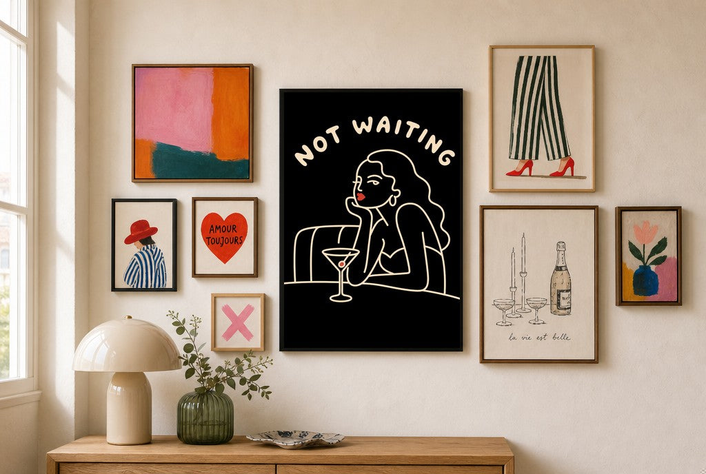 Not Waiting mixed into a layered gallery wall of varied frame sizes.