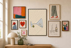 Tipped Martini, Olive mixed into a layered gallery wall of varied frame sizes.