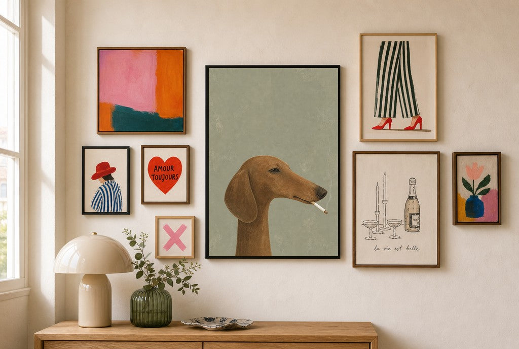 Whippet, Cigarette mixed into a layered gallery wall of varied frame sizes.