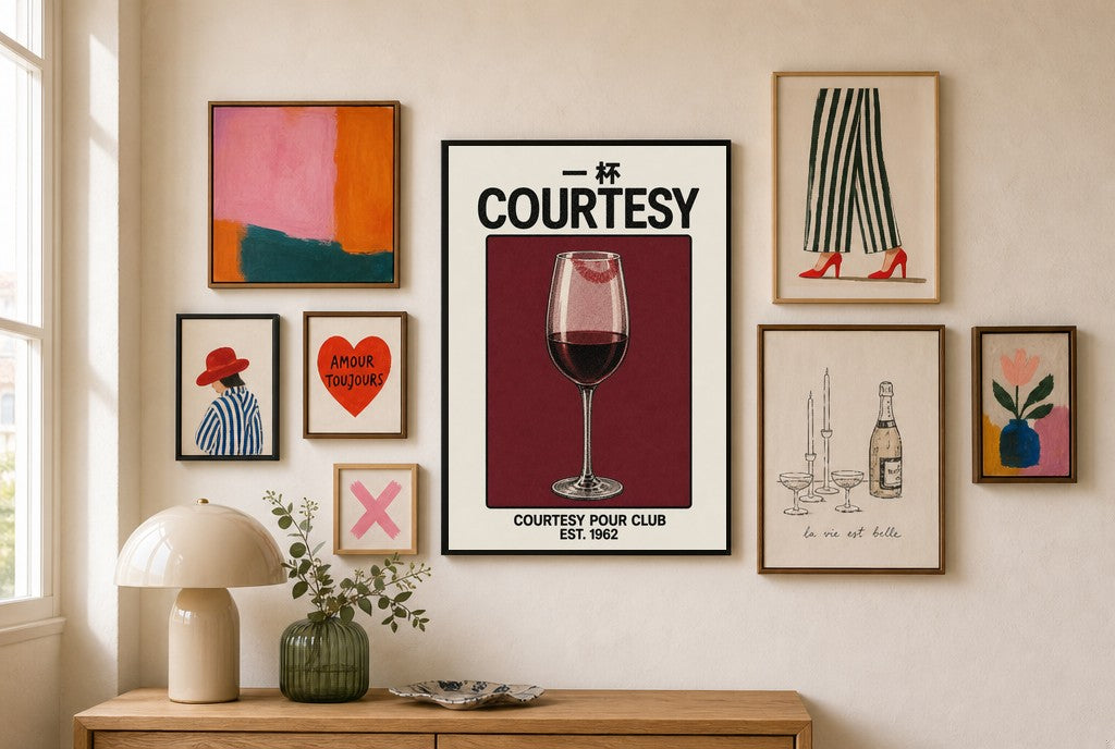 Courtesy Pour, Wine mixed into a layered gallery wall of varied frame sizes.